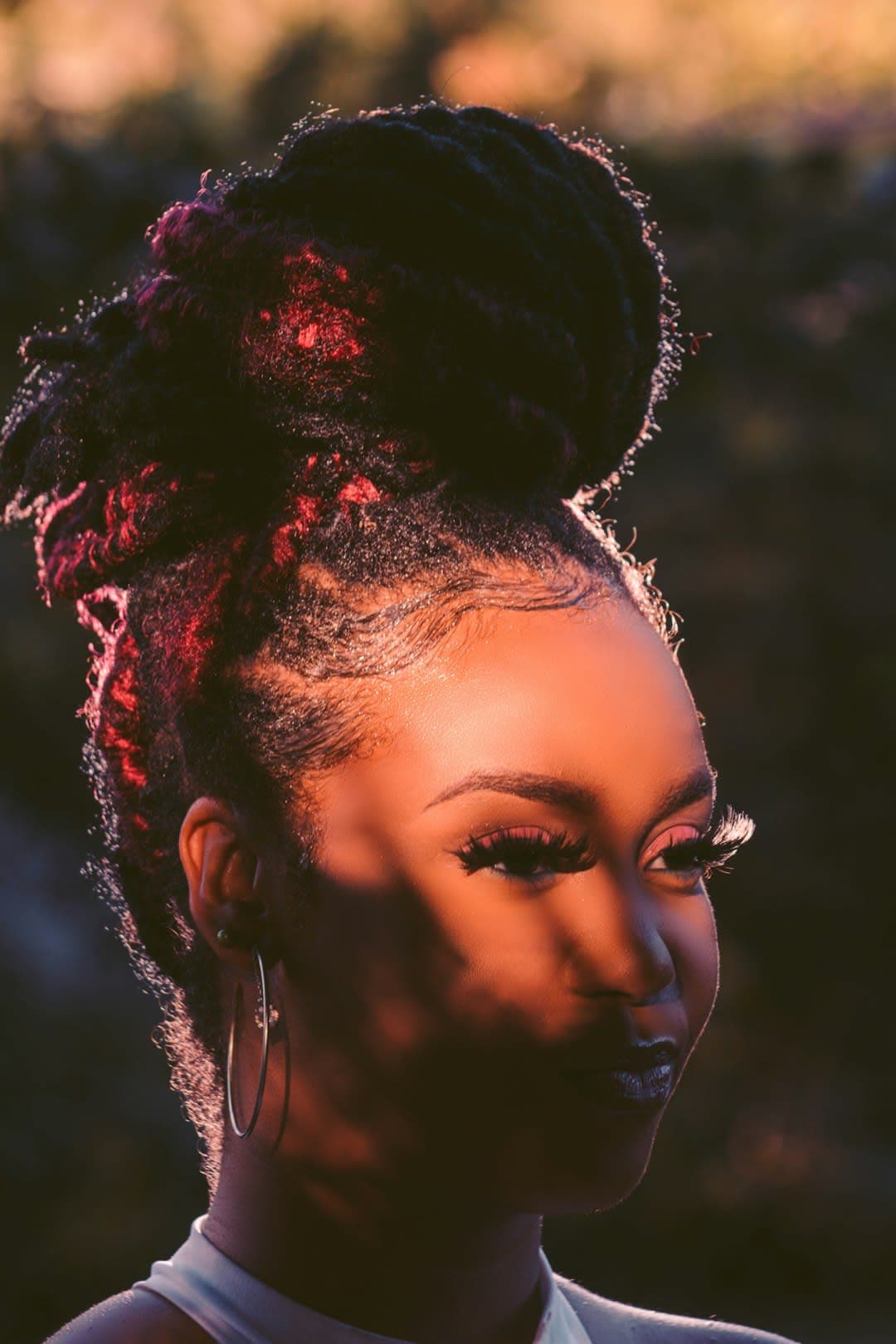 a woman with a top knot in her hair